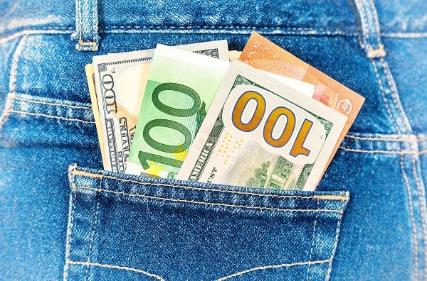 Euro and american currency, money in jeans pocket for travel and shopping