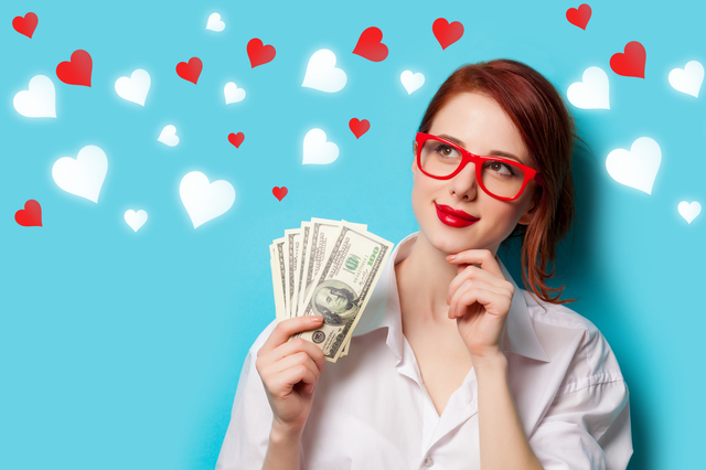 women in red glasses with money